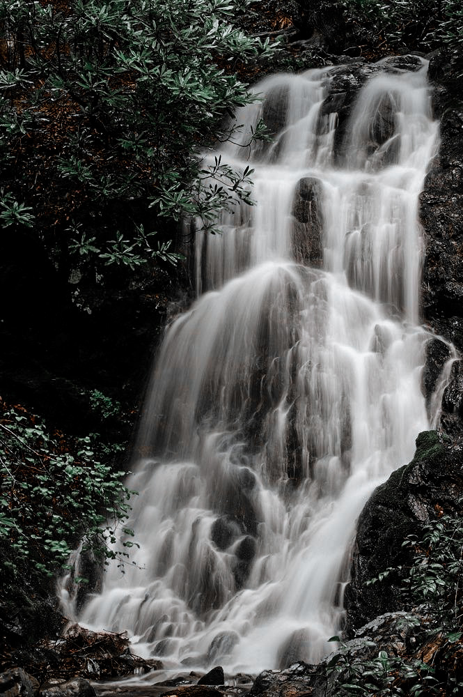 Cataract Falls illuminates the mountain side as it flows down. Exploring Gatlinburg has never been so pretty!