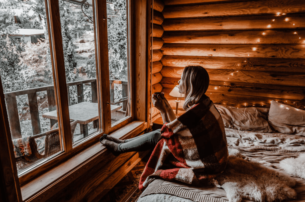 Drinking hot coco is a pro of cabin life