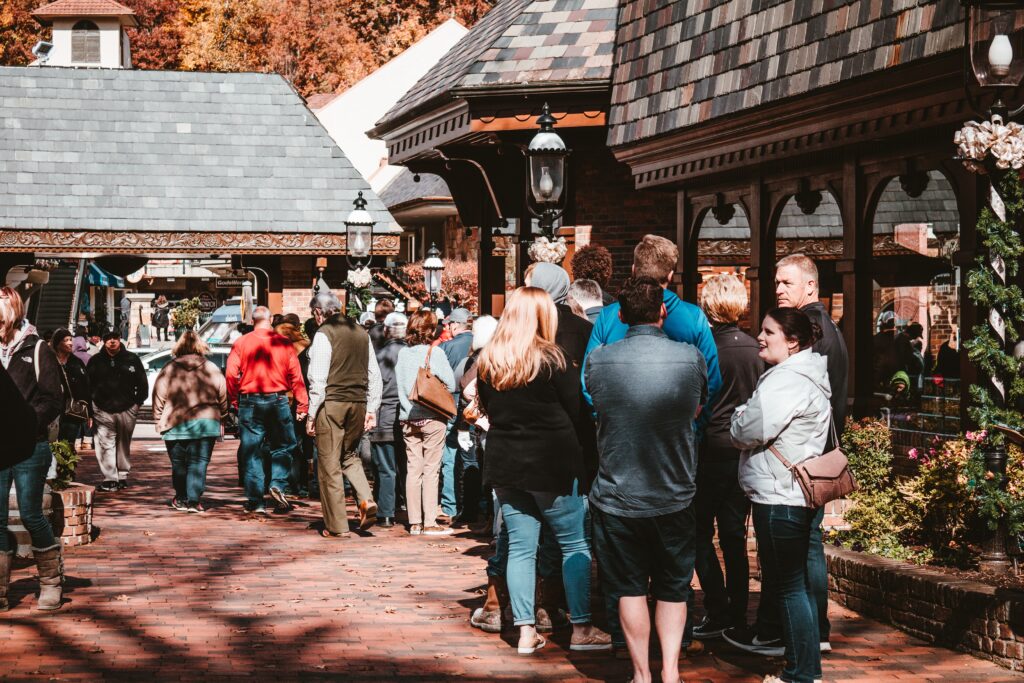 Gatlinburg tiurists stand infront of the shops at the Village